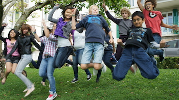 middle school kids in Switzerland jumping