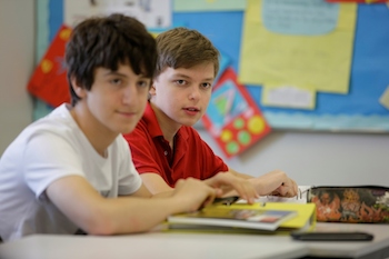 boys studying international middle school