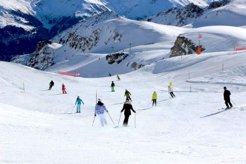 skiing down the slopes in switzerland